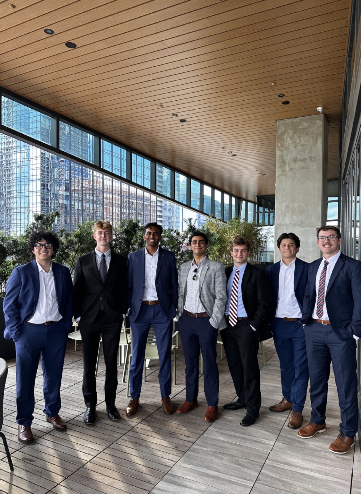 Members on a rooftop terrace overlooking the Austin skyline