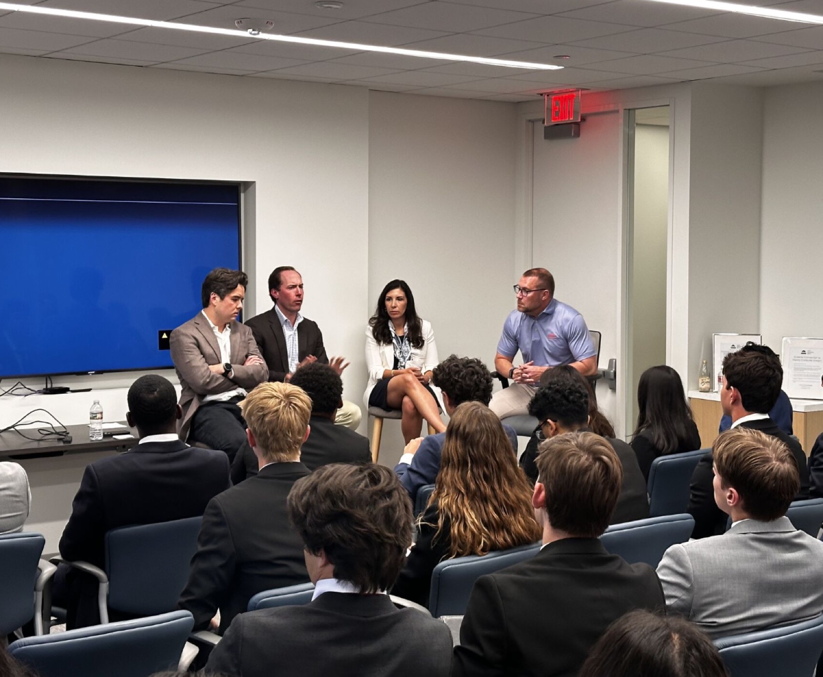 A panel of four speakers at the Houston fireside chat