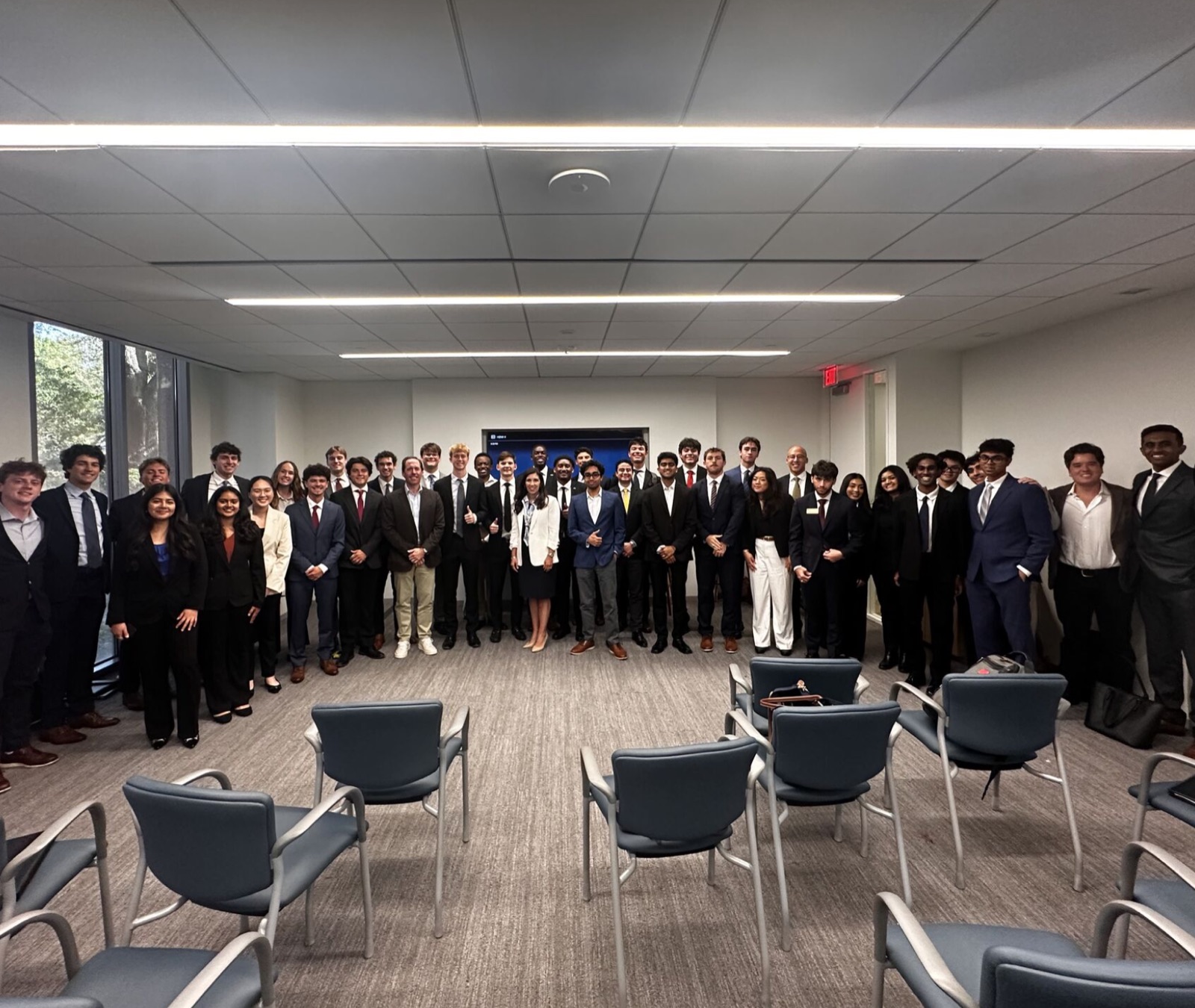The full group photographed together in Houston